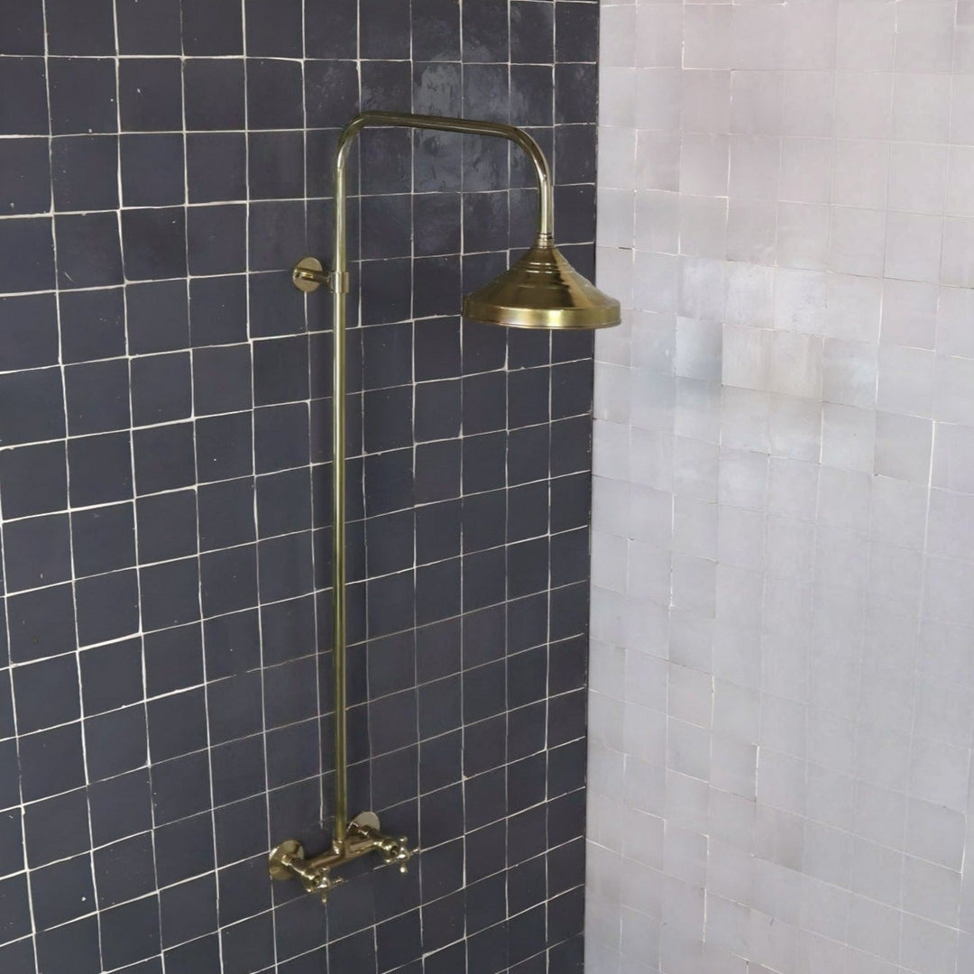 Unlacquered brass exposed shower system with a domed shower head